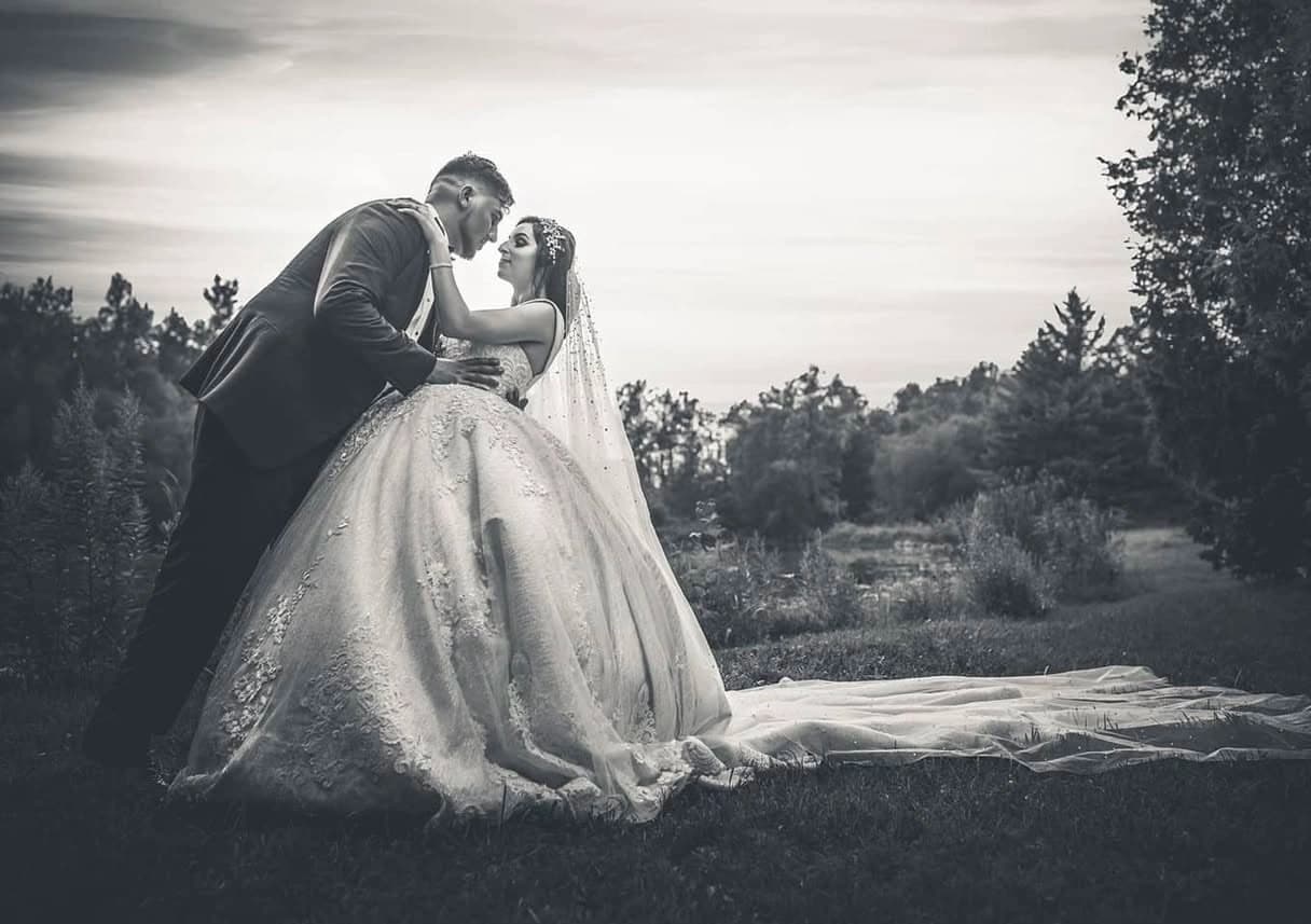 Bride and groom on estate grounds